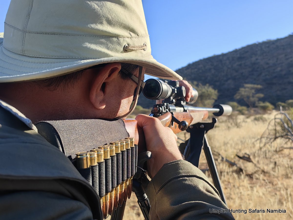 Bryce with rifle on hunt 24